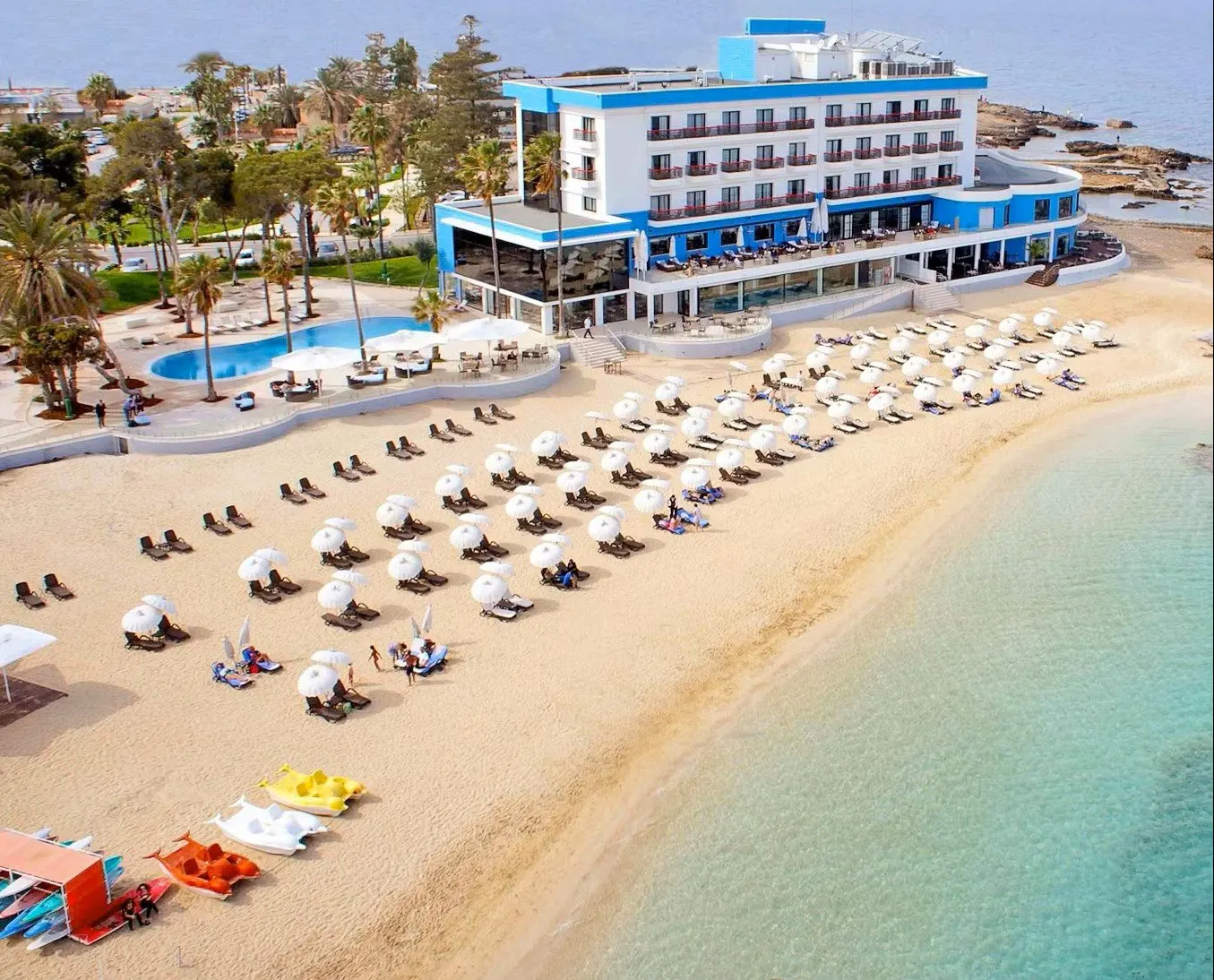 Private luxury taxi arriving at Arkin Palm Beach Hotel, a 5-star beachfront boutique resort in Famagusta, North Cyprus, featuring a golden sand private beach