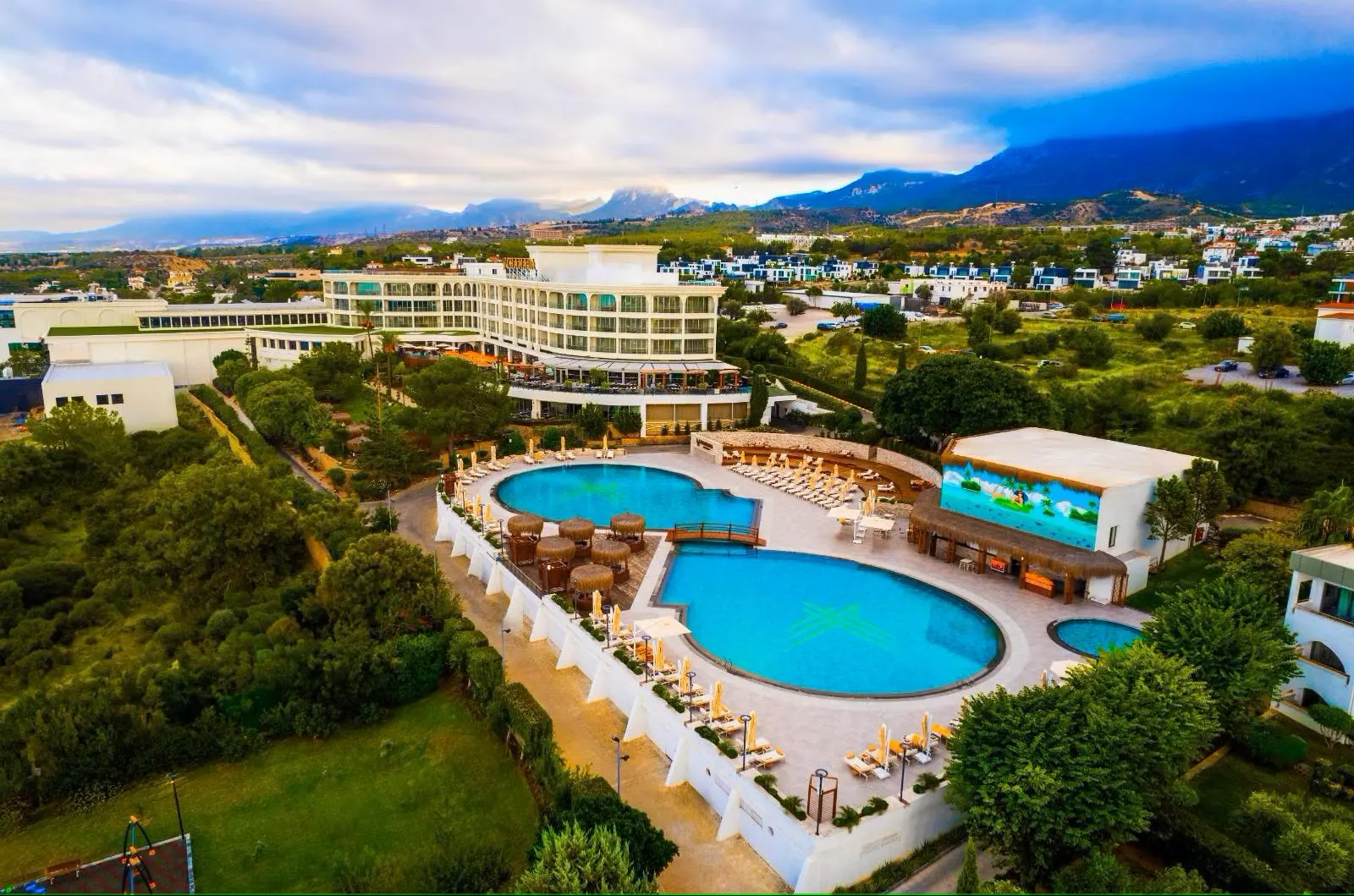 Luxury private taxi arriving at Chamada Prestige Hotel, an ultra-modern 5-star resort in Catalkoy, North Cyprus