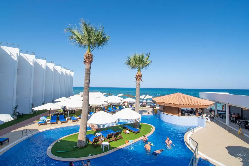 Private luxury taxi arriving at Mimoza Beach Hotel, a peaceful beachfront hotel on the Mediterranean coast of Famagusta, North Cyprus