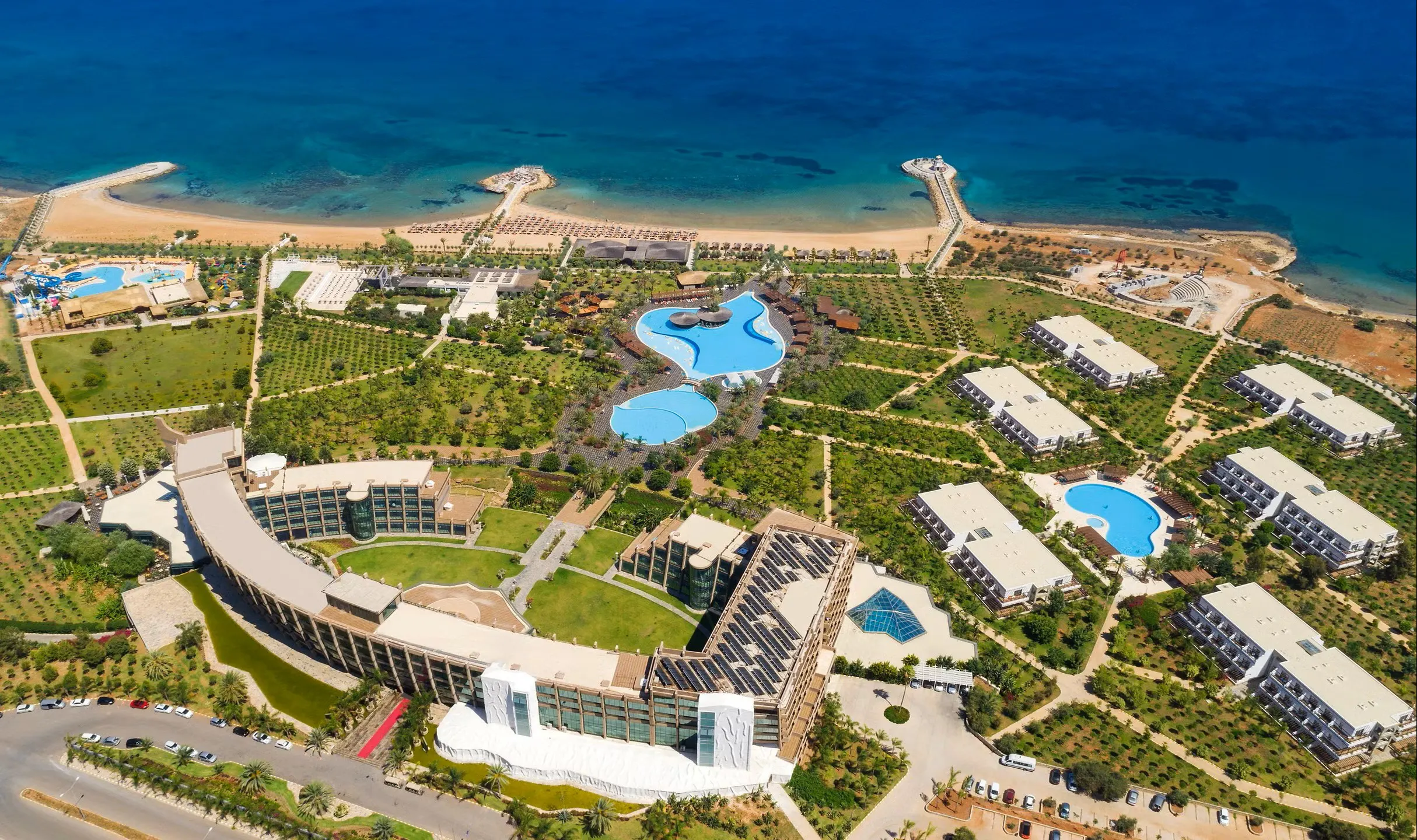 Private luxury taxi arriving at Noah’s Ark Deluxe Hotel & Spa, the iconic ship-shaped 5-star beachfront resort in Bafra, North Cyprus, featuring waterpark and lagoon pools